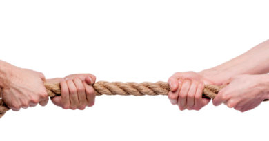 Photo of hands tugging a rope in opposite directions